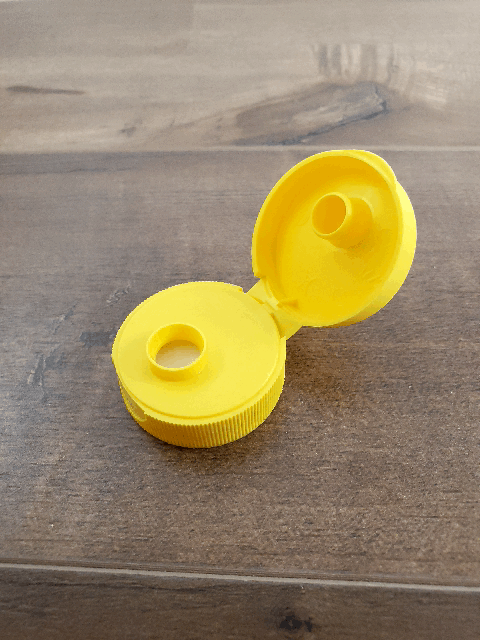 Bouchon jaune PP flip top orifice .375 avec seal C1S/FS11 33/400 - 2500/cs